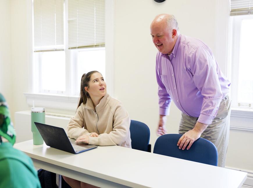 NWU faculty member works with a student. 